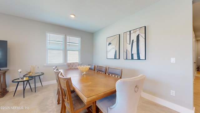 dining area featuring baseboards