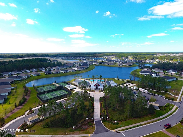 birds eye view of property with a residential view and a water view