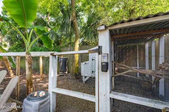 exterior space with exterior structure and fence