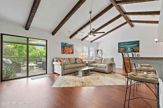 living room with wood finished floors, ceiling fan, lofted ceiling with beams, and baseboards