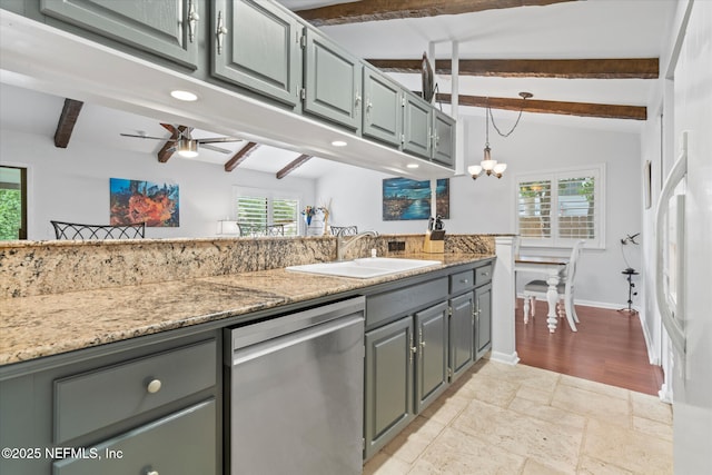 kitchen with stainless steel dishwasher, a sink, gray cabinets, vaulted ceiling with beams, and ceiling fan with notable chandelier