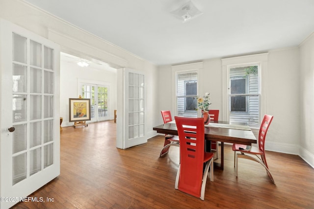 2234 Forbes St, Jacksonville, FL 32204 - dining room featuring baseboards, wood finished floors, and ornamental molding