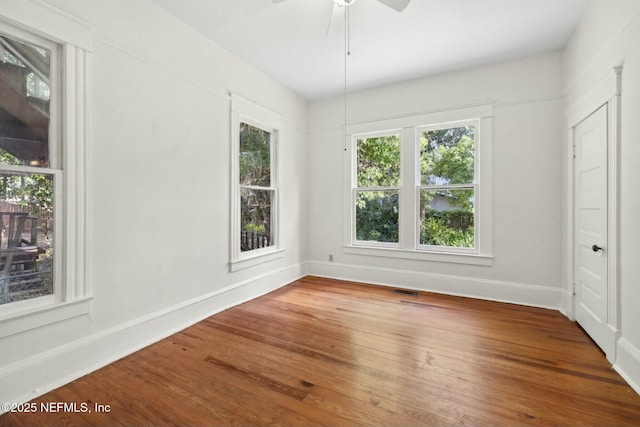2234 Forbes St, Jacksonville, FL 32204 - unfurnished dining area with ceiling fan, baseboards, wood finished floors, and visible vents