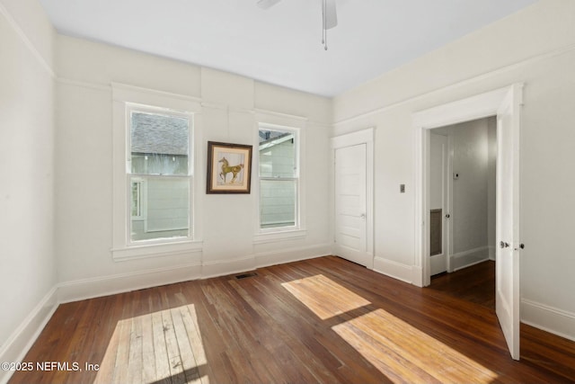 2234 Forbes St, Jacksonville, FL 32204 - unfurnished room featuring hardwood / wood-style flooring, baseboards, a ceiling fan, and visible vents
