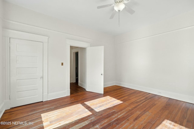 2234 Forbes St, Jacksonville, FL 32204 - unfurnished bedroom featuring wood finished floors, a ceiling fan, and baseboards
