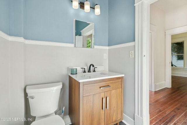 2234 Forbes St, Jacksonville, FL 32204 - bathroom with hardwood / wood-style flooring, toilet, vanity, and baseboards