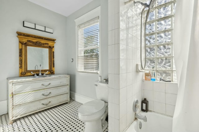 2234 Forbes St, Jacksonville, FL 32204 - full bath with tile patterned floors, baseboards, vanity, and toilet