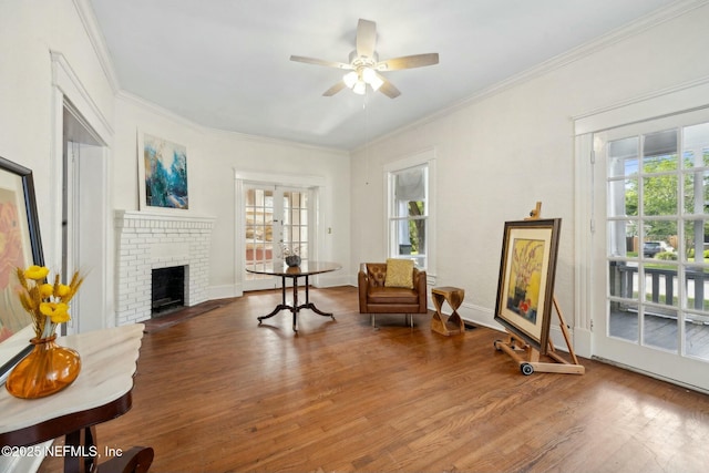 2234 Forbes St, Jacksonville, FL 32204 - sitting room featuring a ceiling fan, wood finished floors, a wealth of natural light, and crown molding