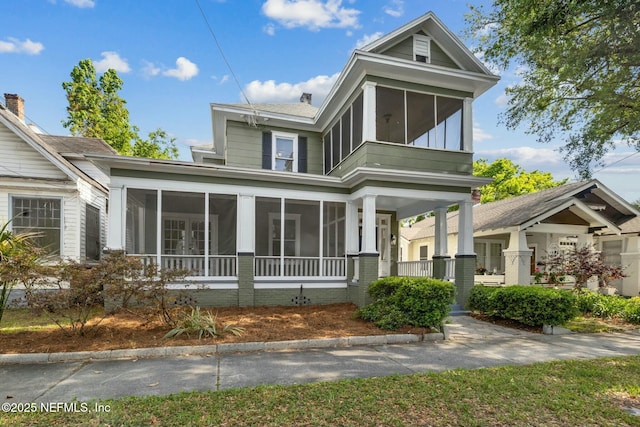 2234 Forbes St, Jacksonville, FL 32204 - view of front of house featuring a chimney and a sunroom