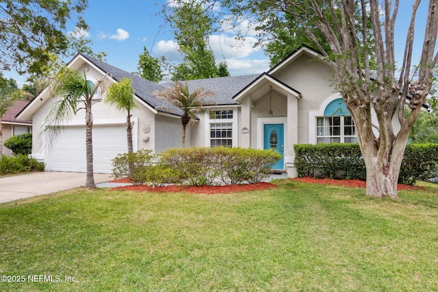 ranch-style home with concrete driveway, a front yard, an attached garage, and stucco siding