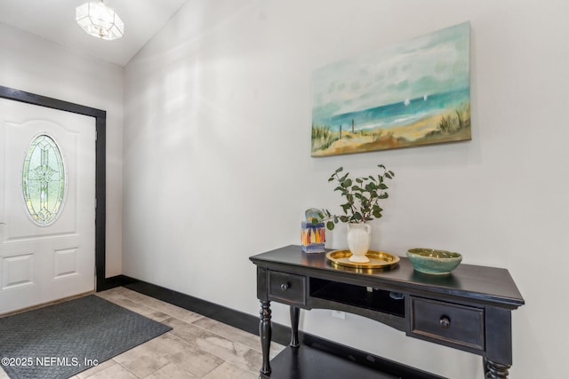entrance foyer featuring lofted ceiling