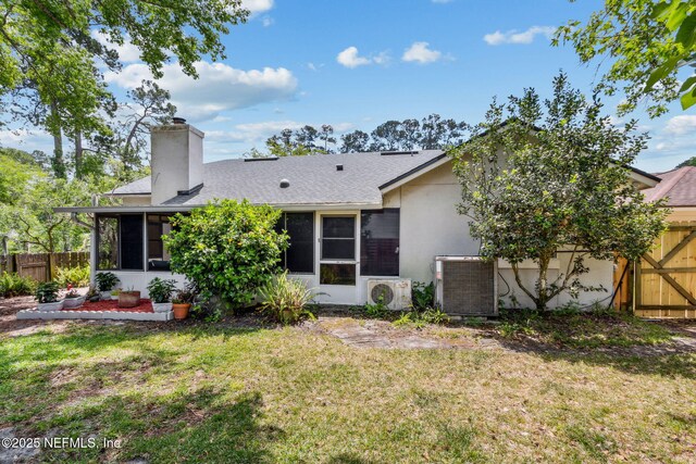 back of house featuring a chimney, stucco siding, fence, a sunroom, and cooling unit