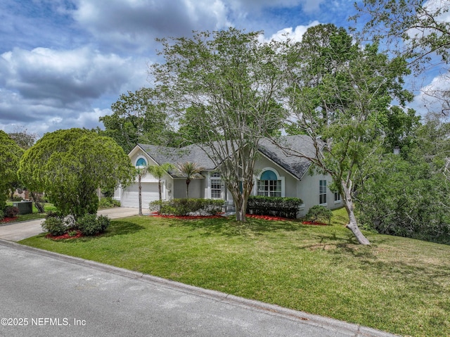 ranch-style house featuring a front lawn, driveway, a garage, and stucco siding