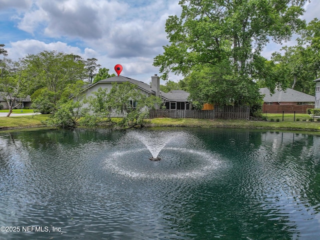 view of water feature with fence