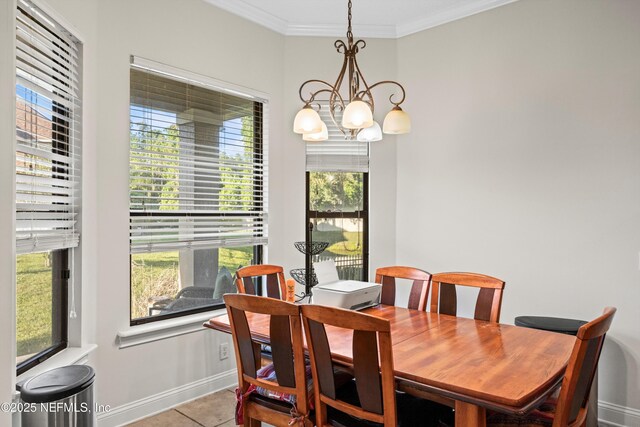 7908 Los Robles Ct Unit 7908, Jacksonville, FL 32256 - dining space with baseboards, tile patterned flooring, a notable chandelier, and crown molding
