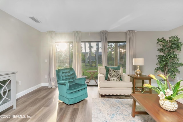 7908 Los Robles Ct Unit 7908, Jacksonville, FL 32256 - sitting room with visible vents, wood finished floors, and baseboards