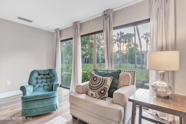 7908 Los Robles Ct Unit 7908, Jacksonville, FL 32256 - living area with wood finished floors, visible vents, and baseboards