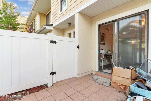 7908 Los Robles Ct Unit 7908, Jacksonville, FL 32256 - view of patio with a gate and fence
