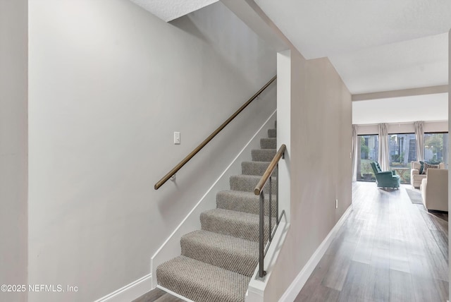 7908 Los Robles Ct Unit 7908, Jacksonville, FL 32256 - stairs featuring baseboards and wood finished floors