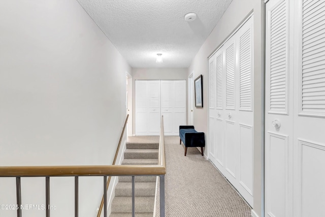 7908 Los Robles Ct Unit 7908, Jacksonville, FL 32256 - hall with a textured ceiling and carpet floors
