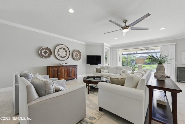living area with crown molding, ceiling fan, and baseboards