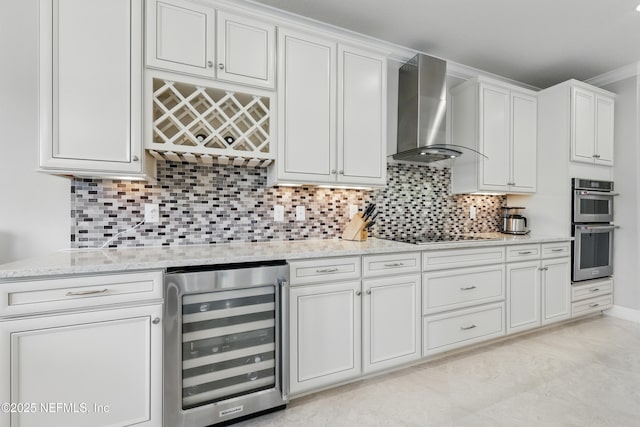 kitchen with wine cooler, tasteful backsplash, wall chimney range hood, and double oven