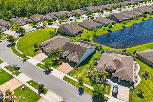 aerial view featuring a residential view and a water view