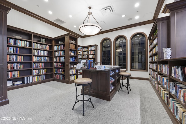 office with crown molding, recessed lighting, bookshelves, and light colored carpet