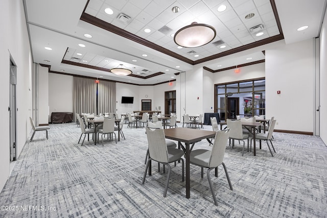dining area with visible vents, ornamental molding, light carpet, recessed lighting, and a raised ceiling