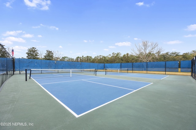 view of sport court with fence