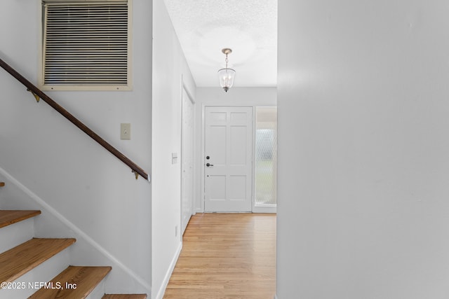 2848 Cedarcrest Dr, Orange Park, FL 32073 - foyer entrance with stairs, light wood-style floors, and baseboards