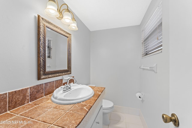 2848 Cedarcrest Dr, Orange Park, FL 32073 - bathroom featuring toilet, vanity, tile patterned floors, and baseboards