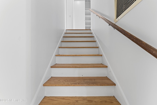 2848 Cedarcrest Dr, Orange Park, FL 32073 - stairs with baseboards, wood finished floors, and visible vents