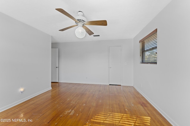 2848 Cedarcrest Dr, Orange Park, FL 32073 - unfurnished room with baseboards, visible vents, hardwood / wood-style flooring, and ceiling fan