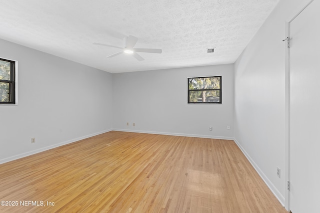 2848 Cedarcrest Dr, Orange Park, FL 32073 - unfurnished room featuring baseboards, light wood-style floors, ceiling fan, and a healthy amount of sunlight