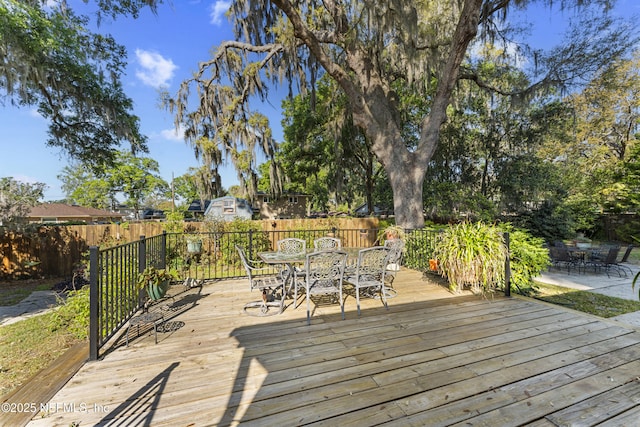 2848 Cedarcrest Dr, Orange Park, FL 32073 - wooden deck with outdoor dining area and fence