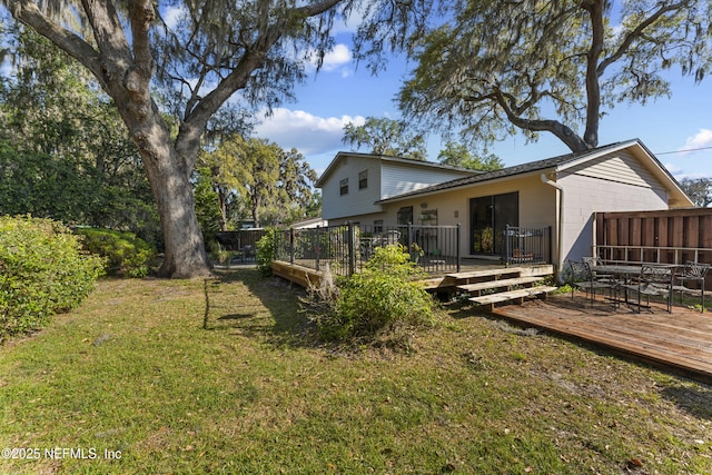 2848 Cedarcrest Dr, Orange Park, FL 32073 - rear view of property featuring a lawn and a deck