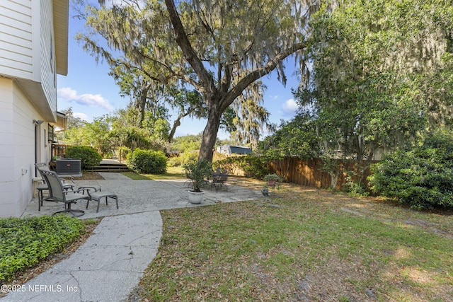 2848 Cedarcrest Dr, Orange Park, FL 32073 - view of yard with a fenced backyard, central AC unit, and a patio