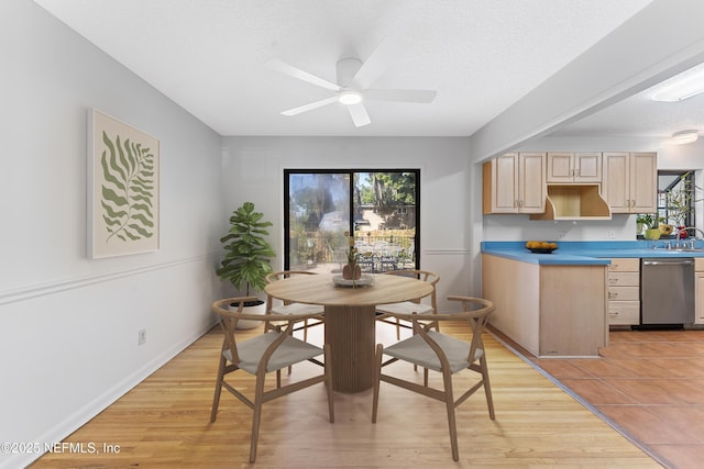 2848 Cedarcrest Dr, Orange Park, FL 32073 - dining room featuring light wood-type flooring, a textured ceiling, and a ceiling fan