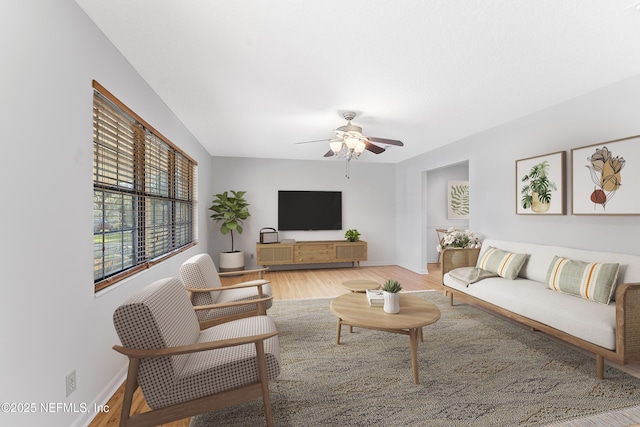 2848 Cedarcrest Dr, Orange Park, FL 32073 - living room featuring light wood finished floors, baseboards, and ceiling fan