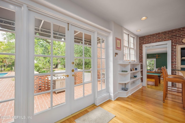 2127 River Rd, Jacksonville, FL 32207 - entryway featuring light wood-type flooring, recessed lighting, brick wall, and french doors