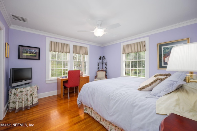 2127 River Rd, Jacksonville, FL 32207 - bedroom with multiple windows, ornamental molding, wood finished floors, and ceiling fan