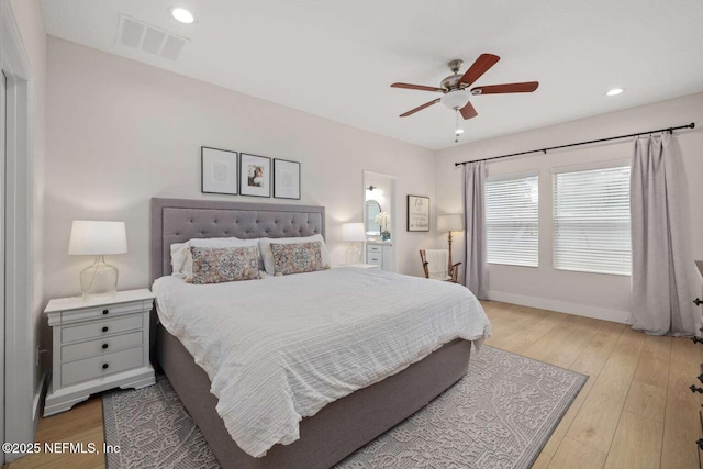 bedroom with recessed lighting, wood finished floors, visible vents, a ceiling fan, and baseboards