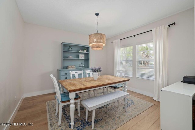 120 Corey Cay Ave, Saint Augustine, FL 32092 - dining room with light wood-style floors, baseboards, and a chandelier
