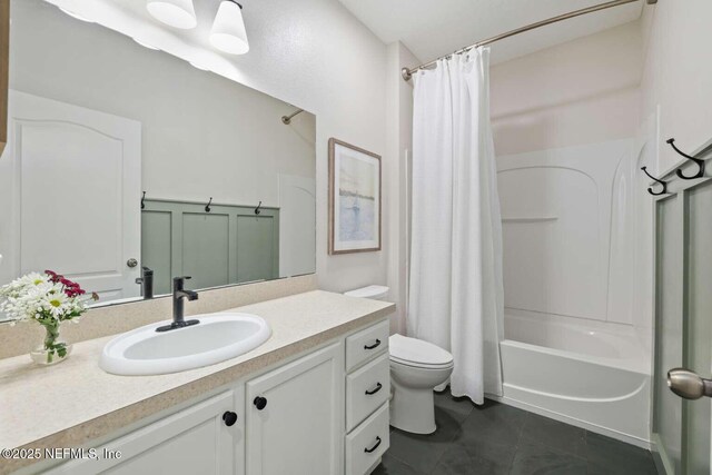 120 Corey Cay Ave, Saint Augustine, FL 32092 - bathroom featuring vanity, toilet, tile patterned floors, and shower / tub combo with curtain