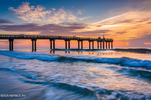 dock area featuring a water view and a pier