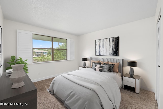 bedroom featuring carpet flooring and baseboards