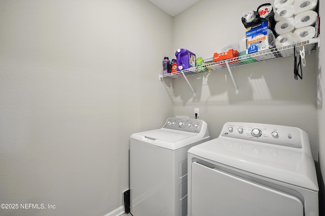 7142 Mahogany Run Dr, Jacksonville, FL 32244 - clothes washing area featuring washing machine and clothes dryer, baseboards, and laundry area