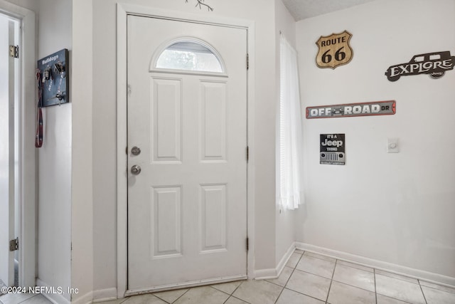 8634 Greatpine Ln W, Jacksonville, FL 32244 - entryway featuring baseboards and light tile patterned floors
