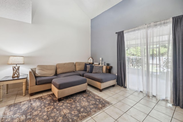 8634 Greatpine Ln W, Jacksonville, FL 32244 - living area featuring tile patterned floors and high vaulted ceiling